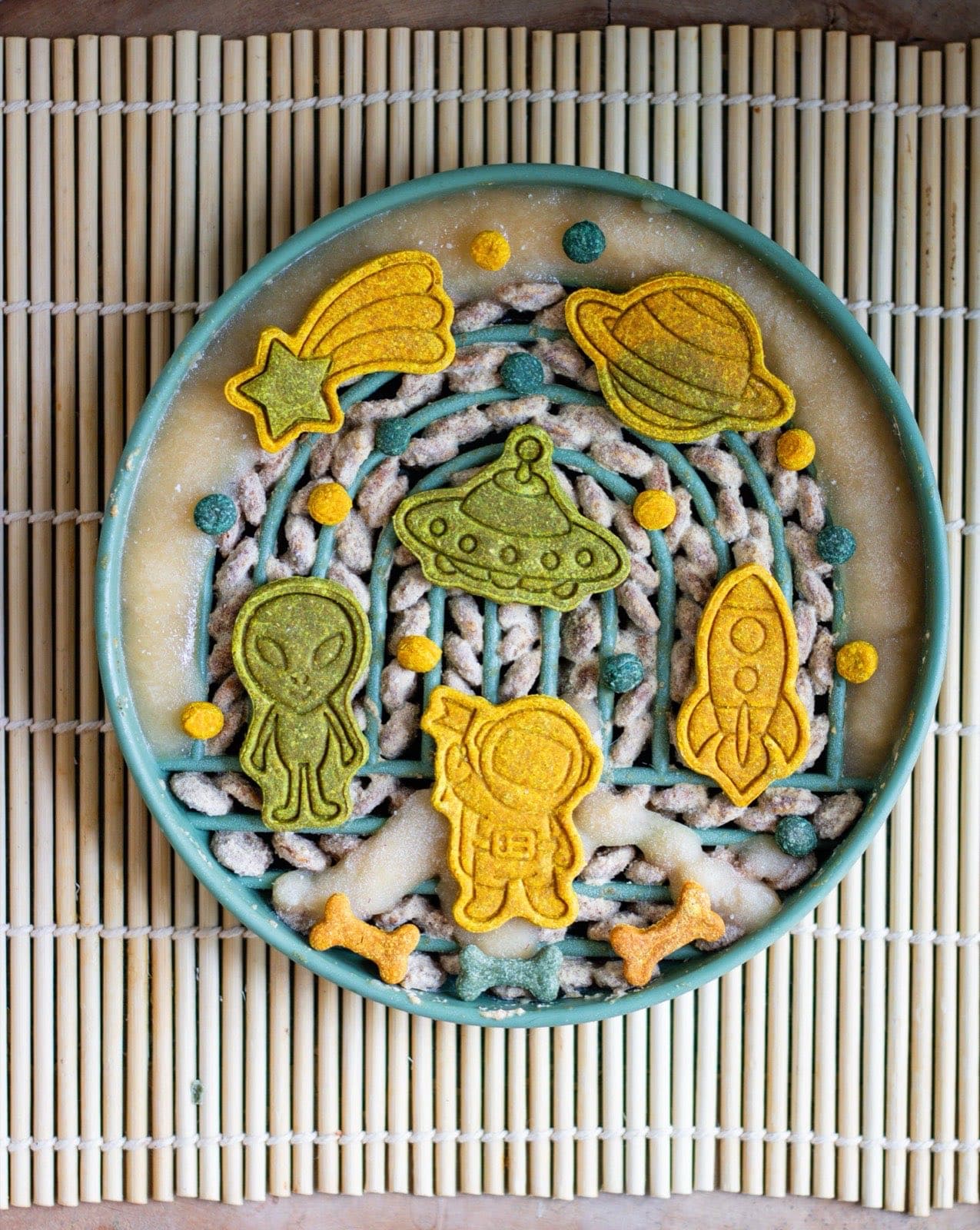 Frozen bowl filled with apple sauce and space-themed treats